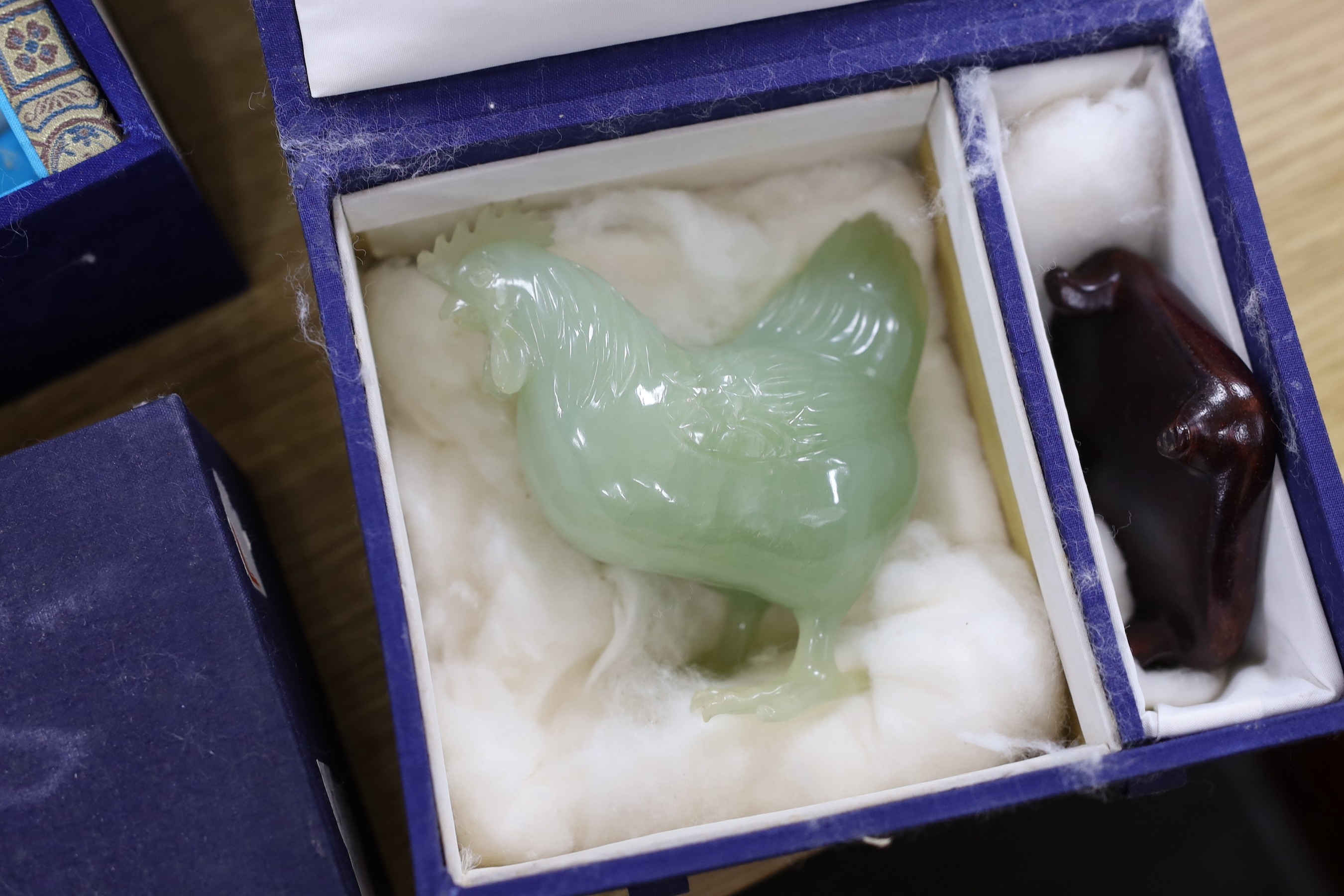 Four assorted boxed of jades and bowenite jades and a blanc de chine figure, 26.5cms high